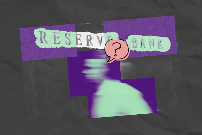 A man walks past the Reserve Bank of Australia sign with a question mark above his head