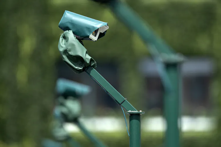 A video camera at the end of a long, angled post