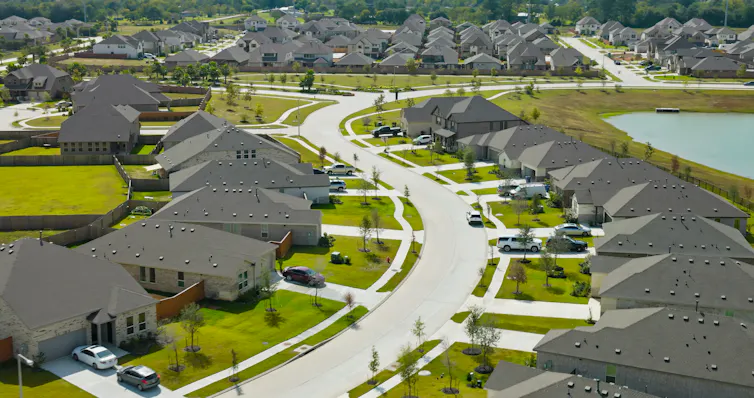 Nearly identical homes with nearly identical lawns stretch for blocks.