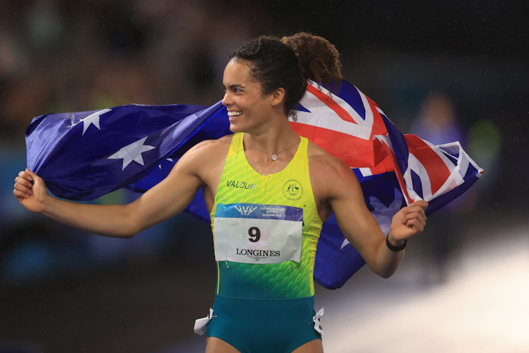 Bronze medallist Torrie Lewis of Australia celebrates setting a new national 100m record at the Commonwealth Games.