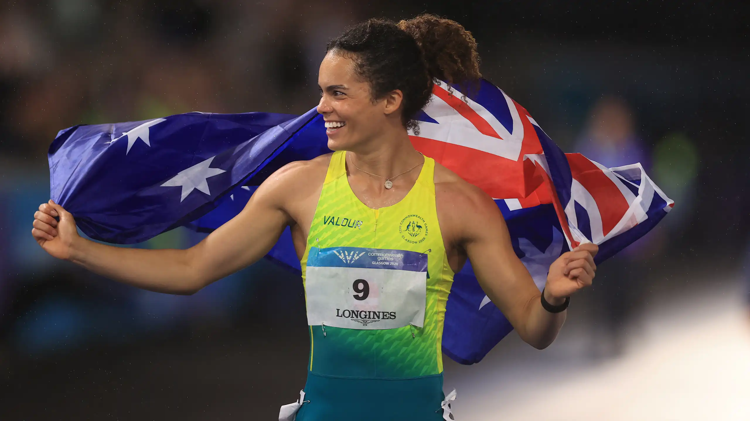 Bronze medallist Torrie Lewis of Australia celebrates setting a new national 100m record at the Commonwealth Games.