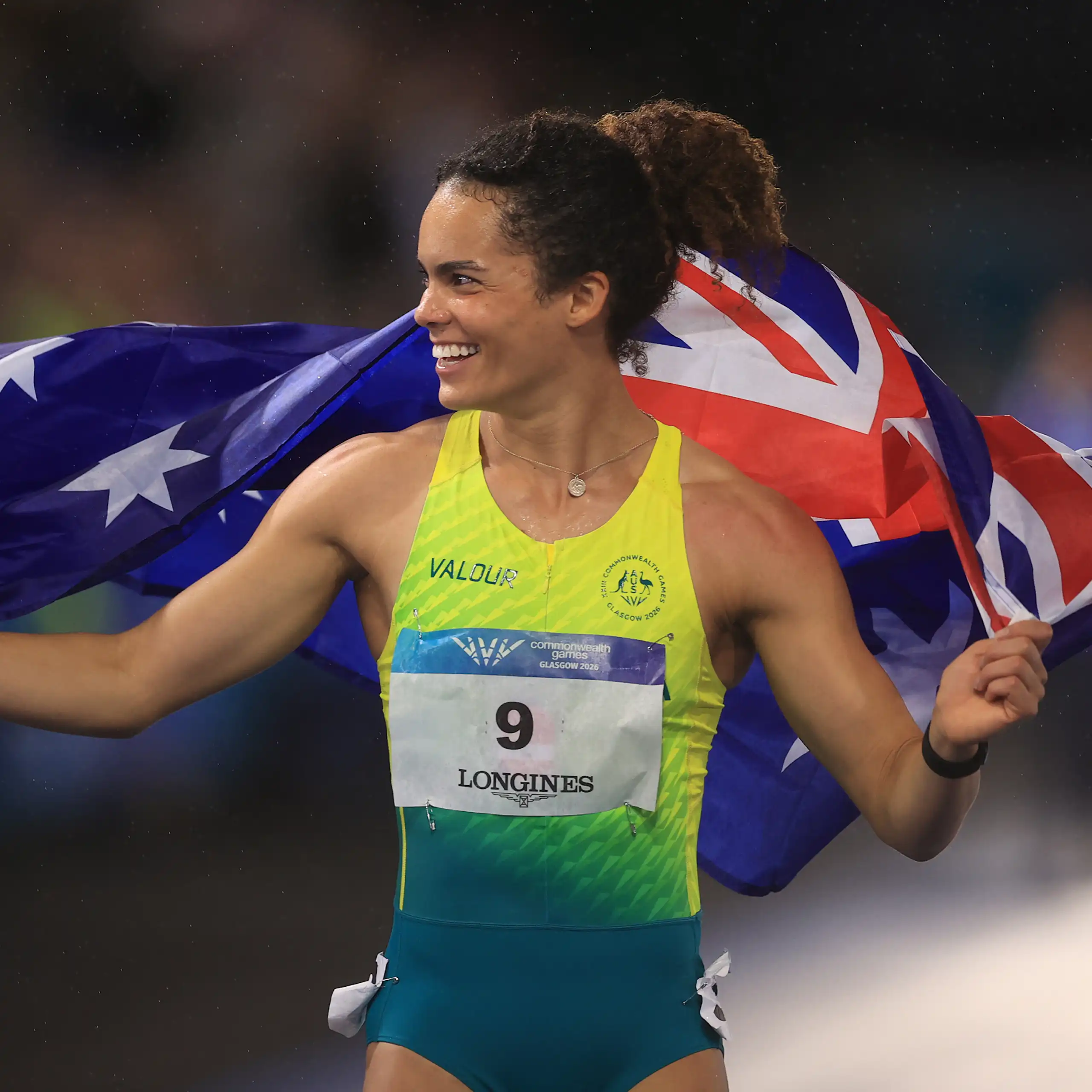 Bronze medallist Torrie Lewis of Australia celebrates setting a new national 100m record at the Commonwealth Games.
