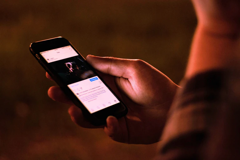 A person scrolling on a social media feed.