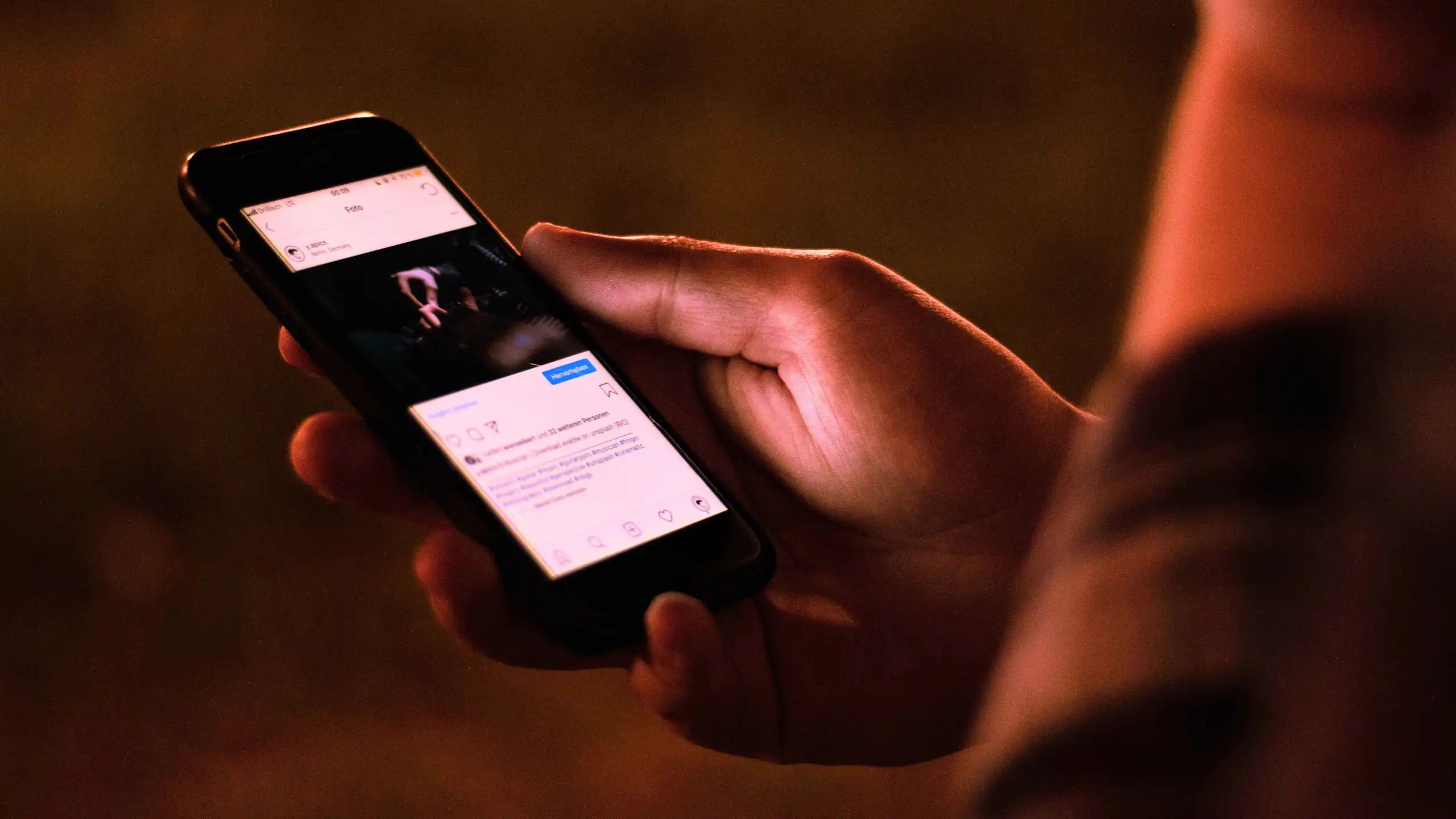 A person scrolling on a social media feed.