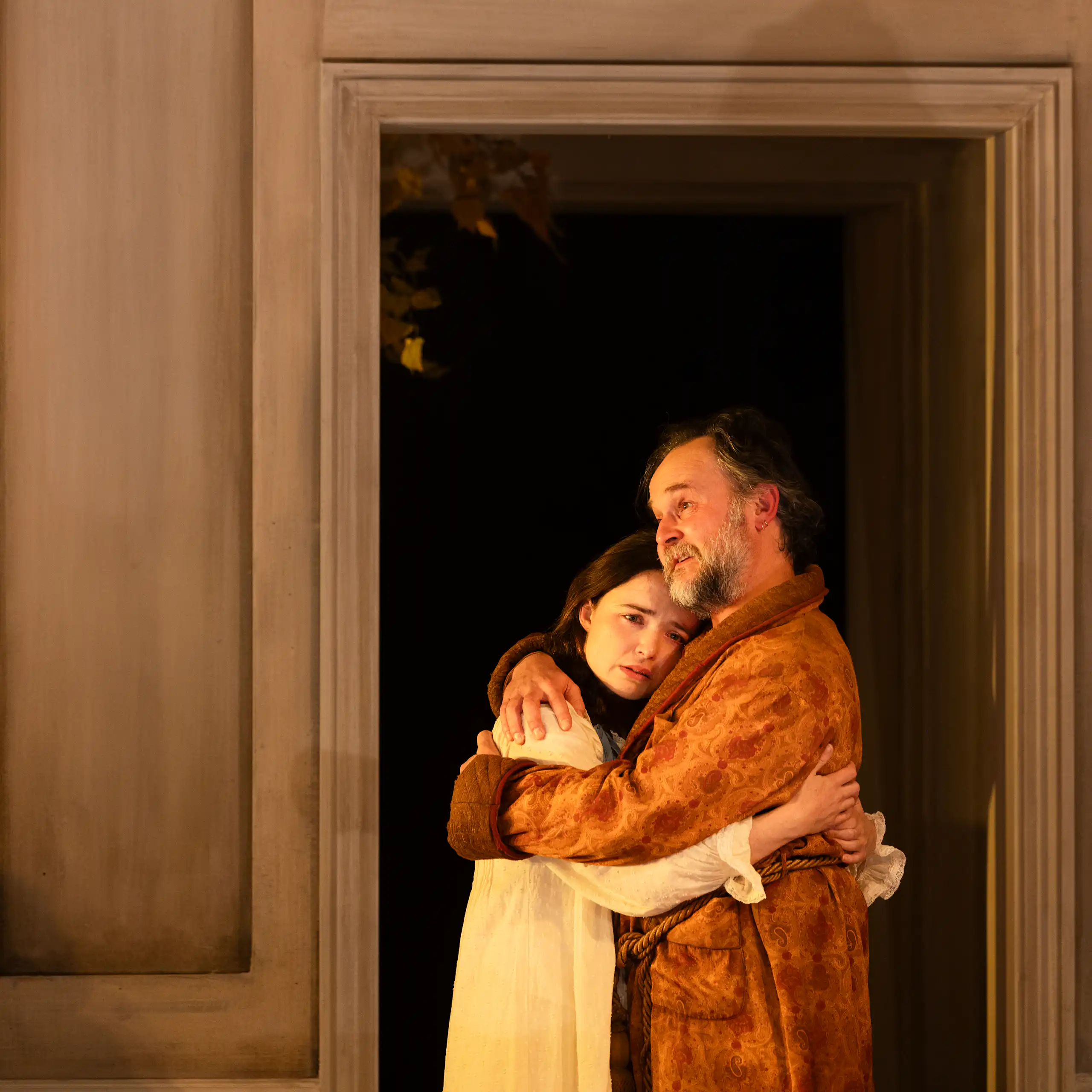 Production image: Uncle Vanya hugs his niece.