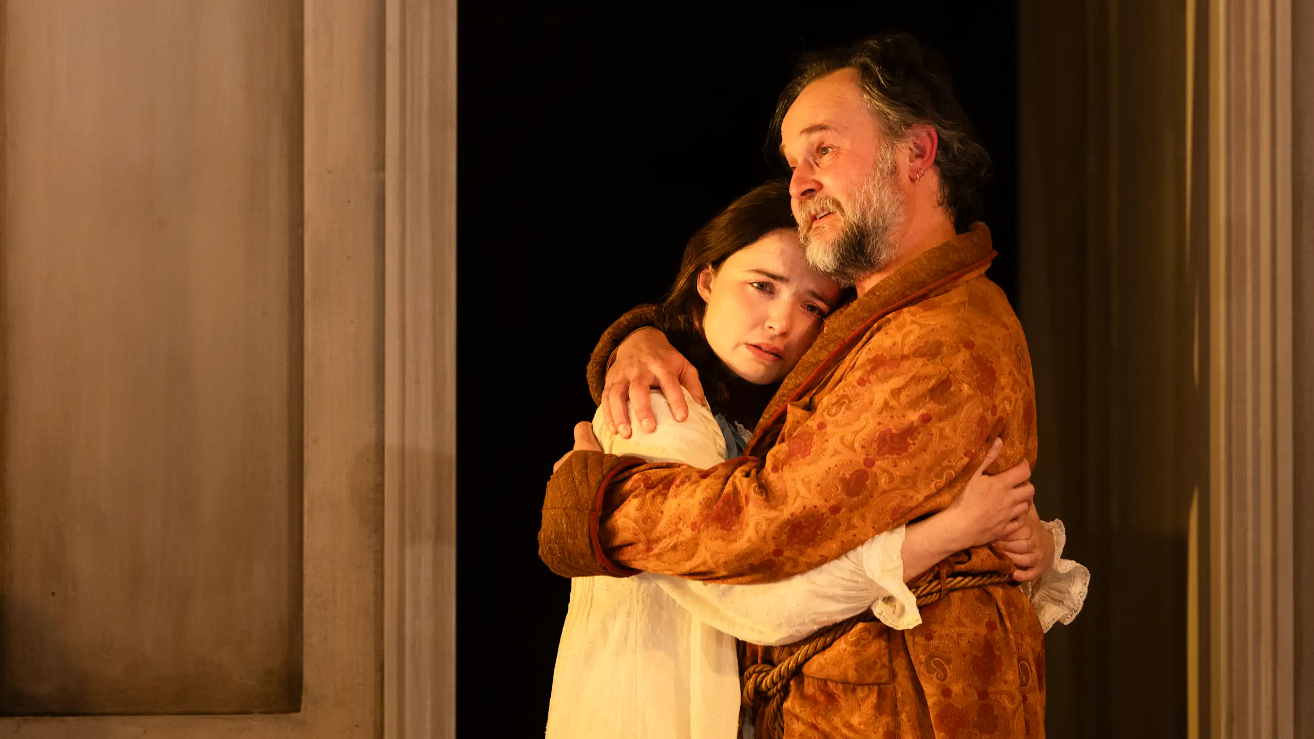 Production image: Uncle Vanya hugs his niece.