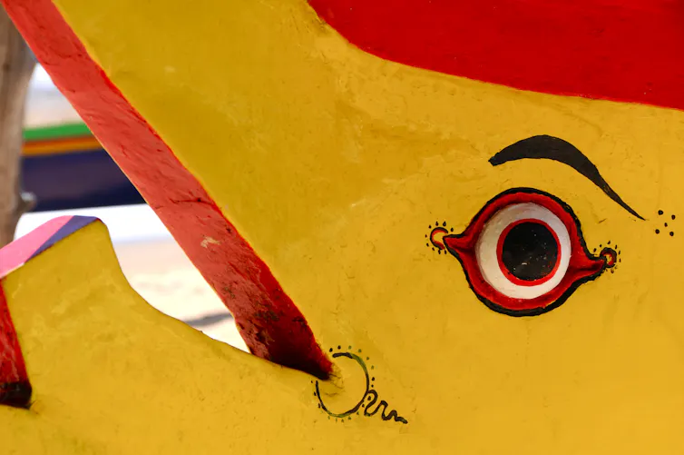 Elephant-fish imagery painted and carved onto traditional Balinese _jukung_ (fishing boat).