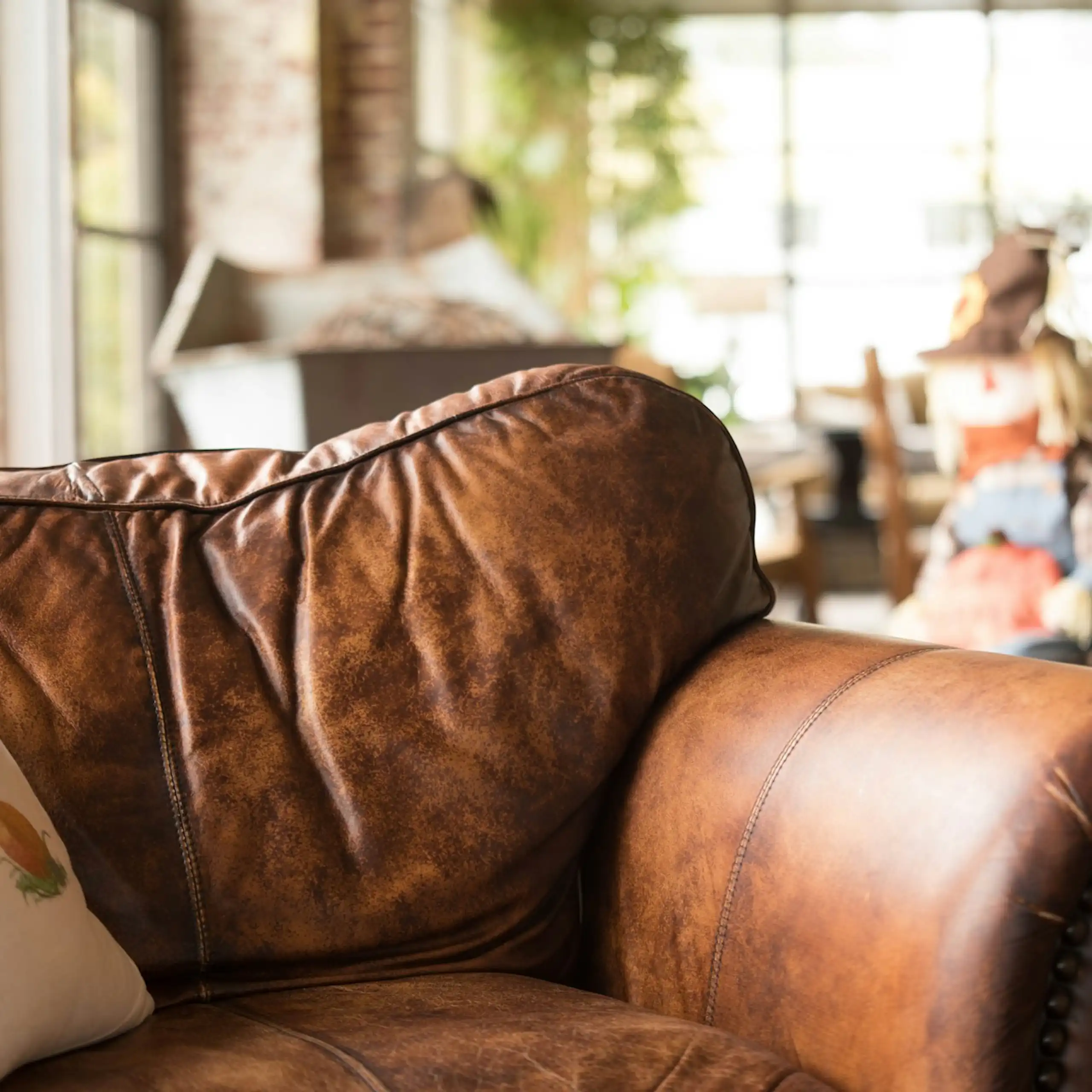 Old brown leather sofa in warehouse or apartment