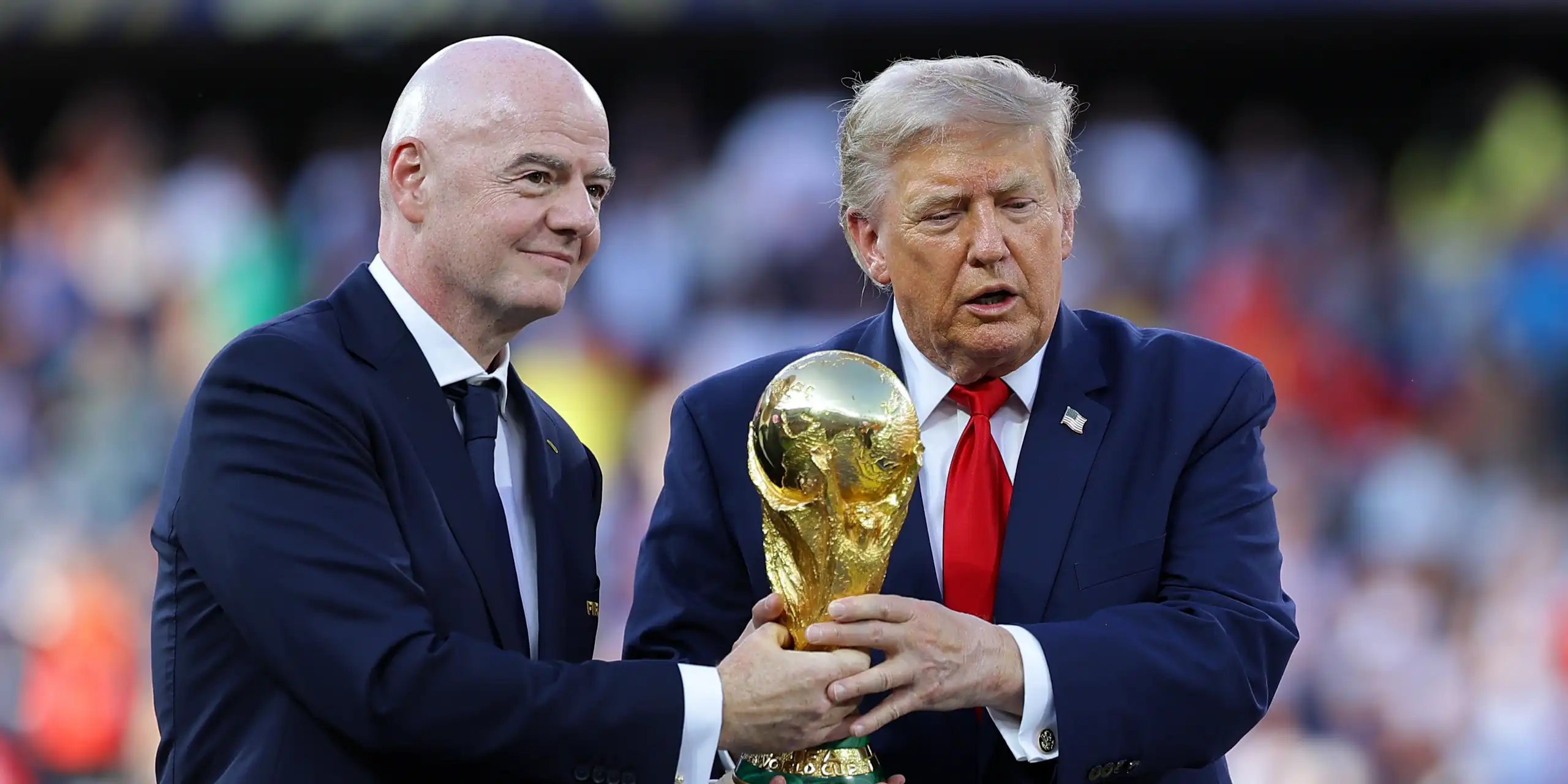 Fifa president, Gianni Infantino, with US president Donald Trump, holding the World Cup trophy.