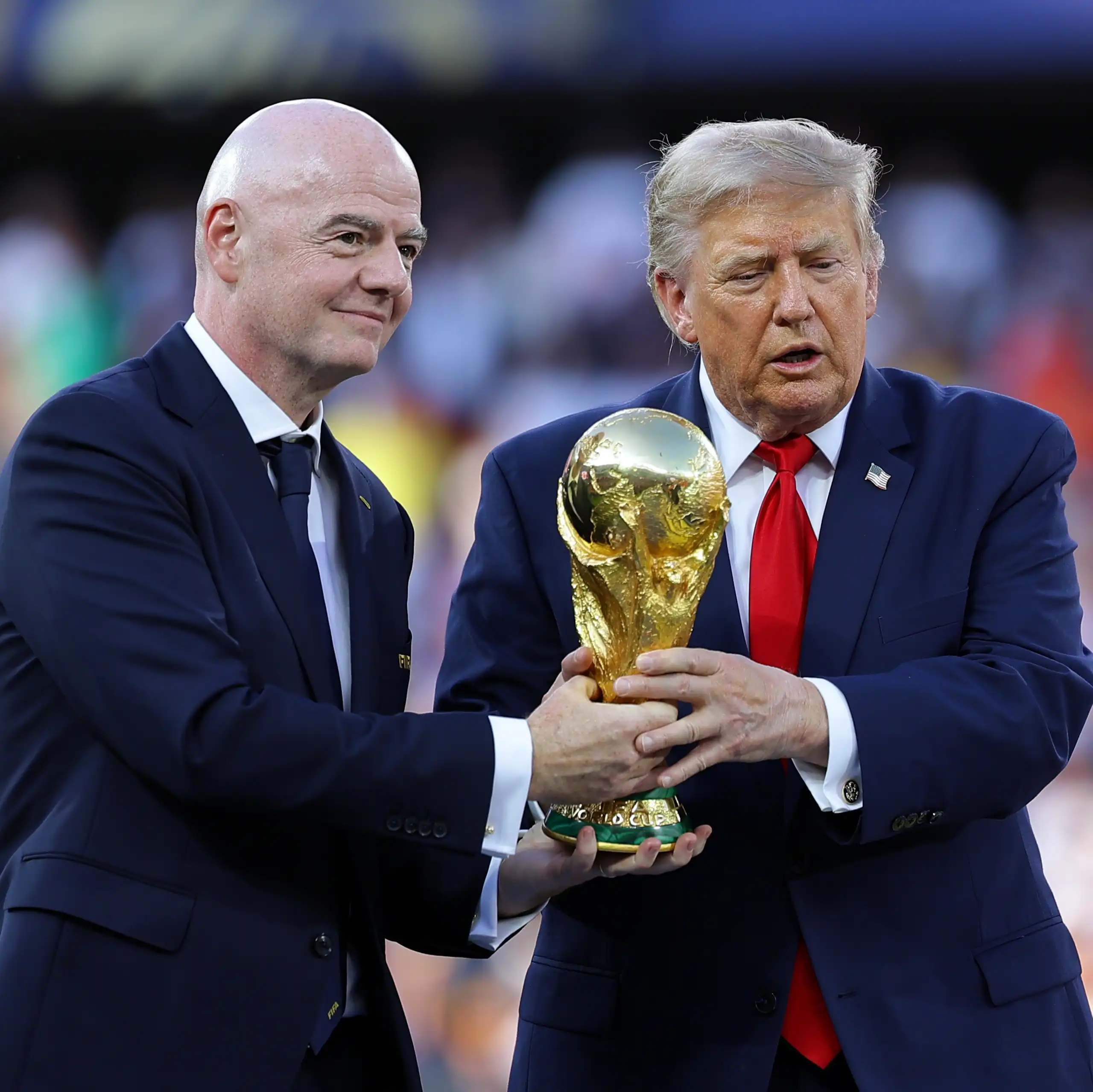 Fifa president, Gianni Infantino, with US president Donald Trump, holding the World Cup trophy.