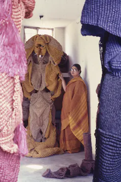 Mrinalini Mukherjee with large colourful hemp sculptures
