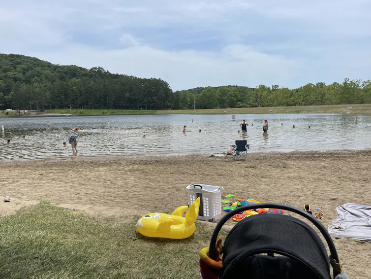 People play in a lake that has shrunk