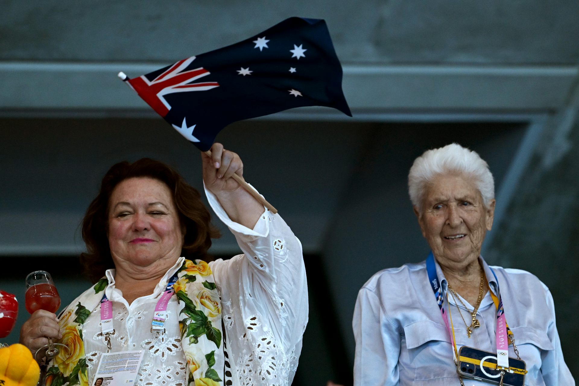 Gina Rinehart and Dawn Fraser cheer on Australia's swim team at the 2024 Paris Olympics.