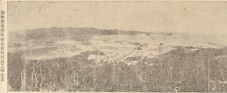 A grainy photo of a large industrial complex.