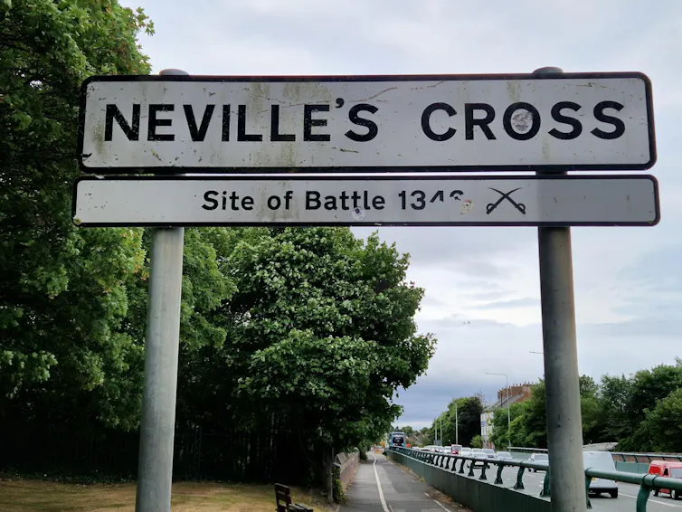 A street sign showing the historical significance of Neville’s Cross on the A167.