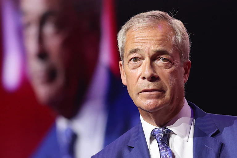 reform leader nigel farage on stage at the CPAC GB conference in london.