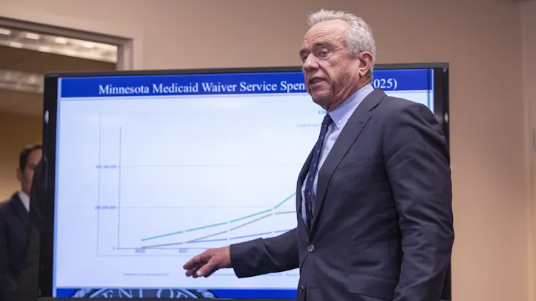 Robert F. Kennedy Jr. points to a chart pertaining to Medicaid fraud.