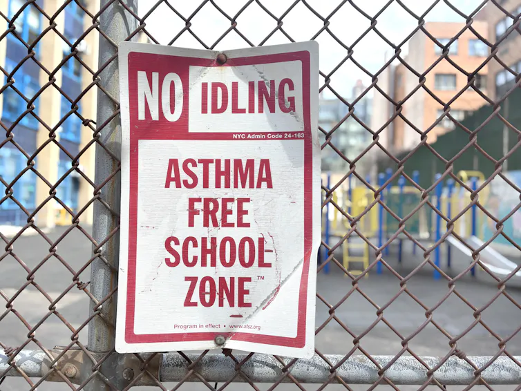 A sign reads 'No idling. Asthma free school zone.'