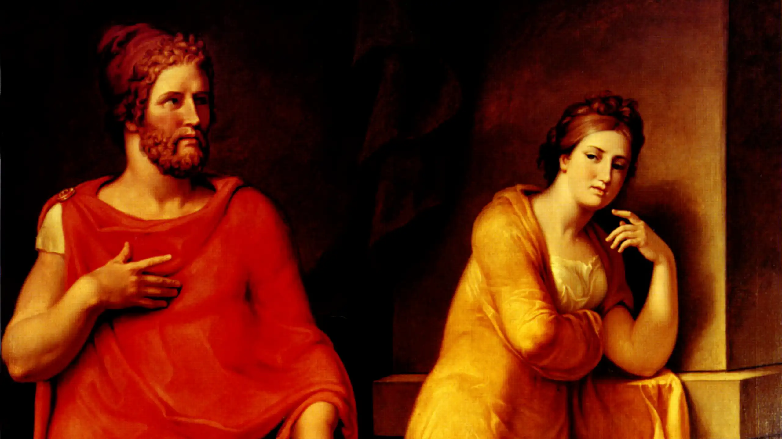a man in a red robe and woman looking a bit bored in gold robe