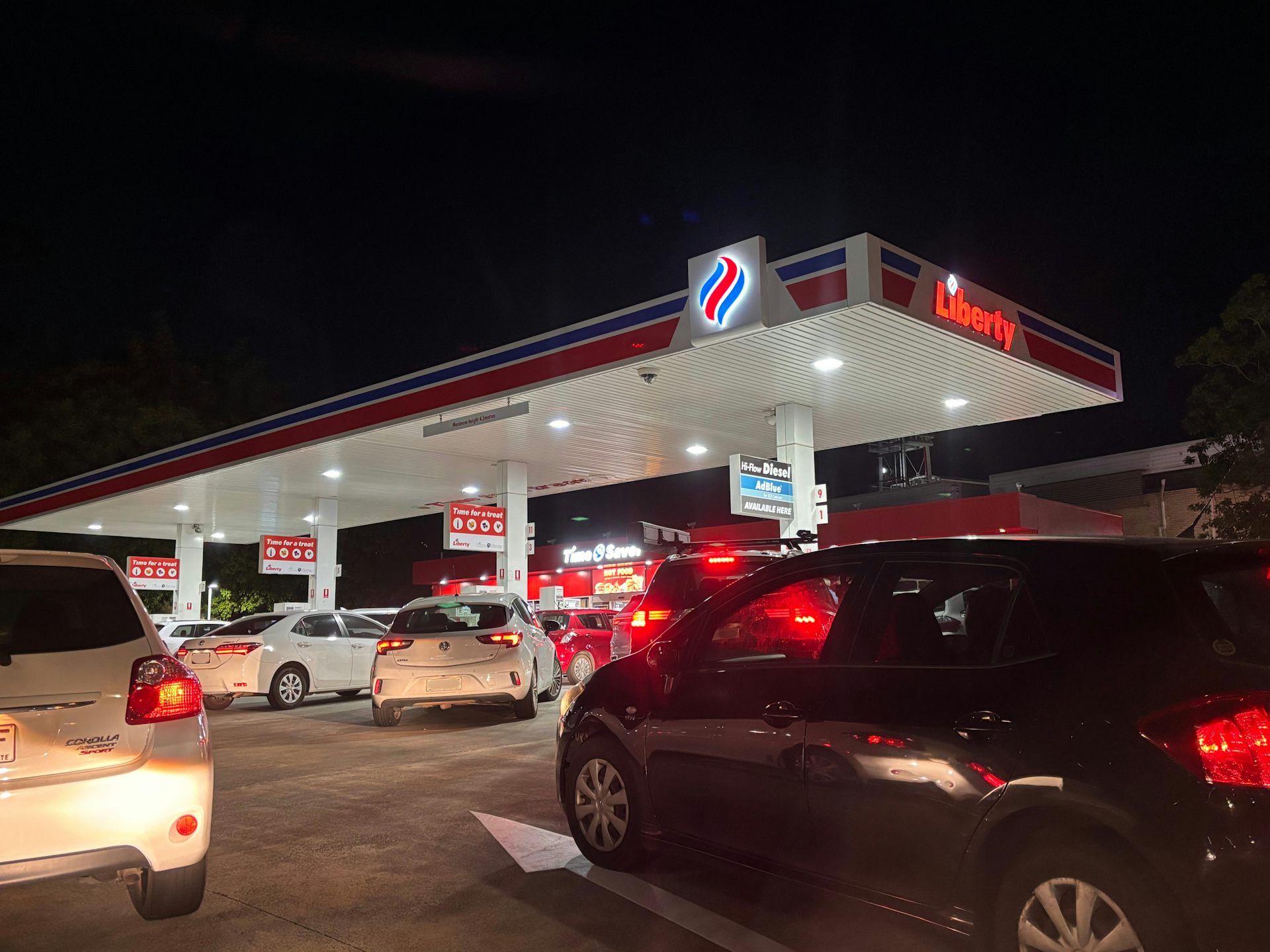 Several cars wait to fill up at a Brisbane petrol station.