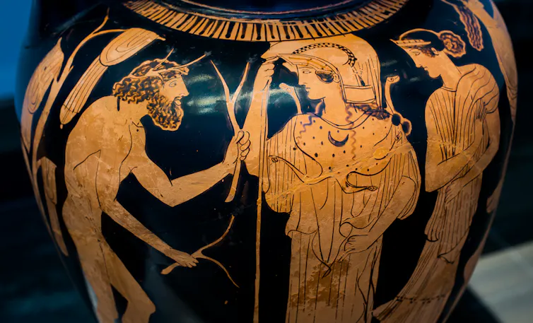 A vase with people painted on it - ancient Greek