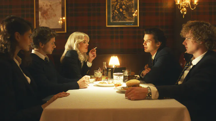 Production image: five teenagers in an upscale restaurant.