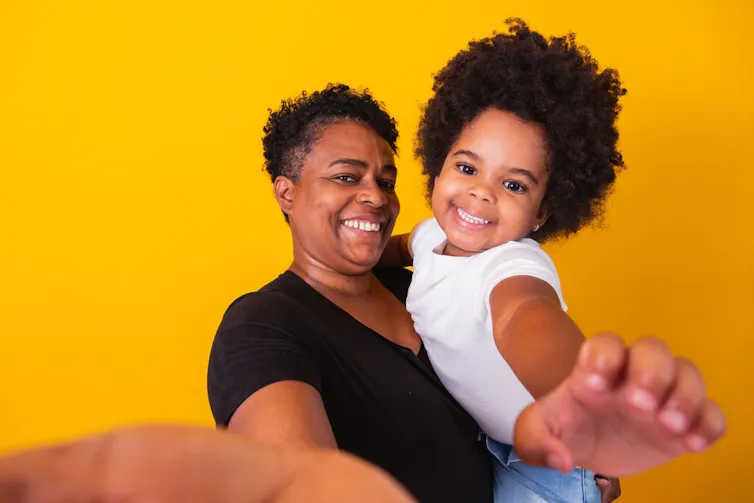 Middle aged woman with her little girl