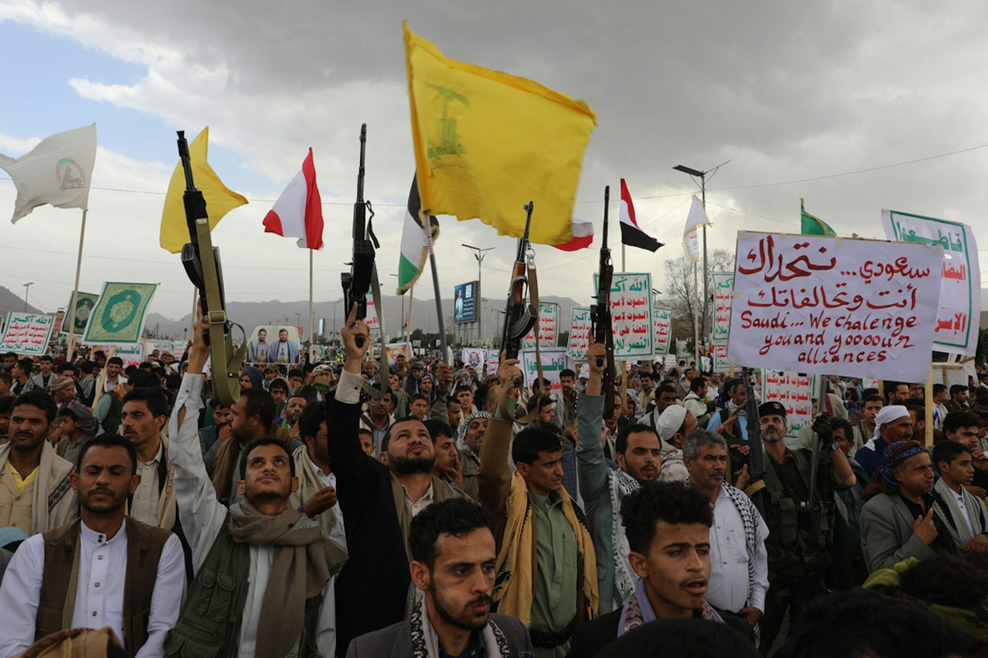 Men chant at a rally.
