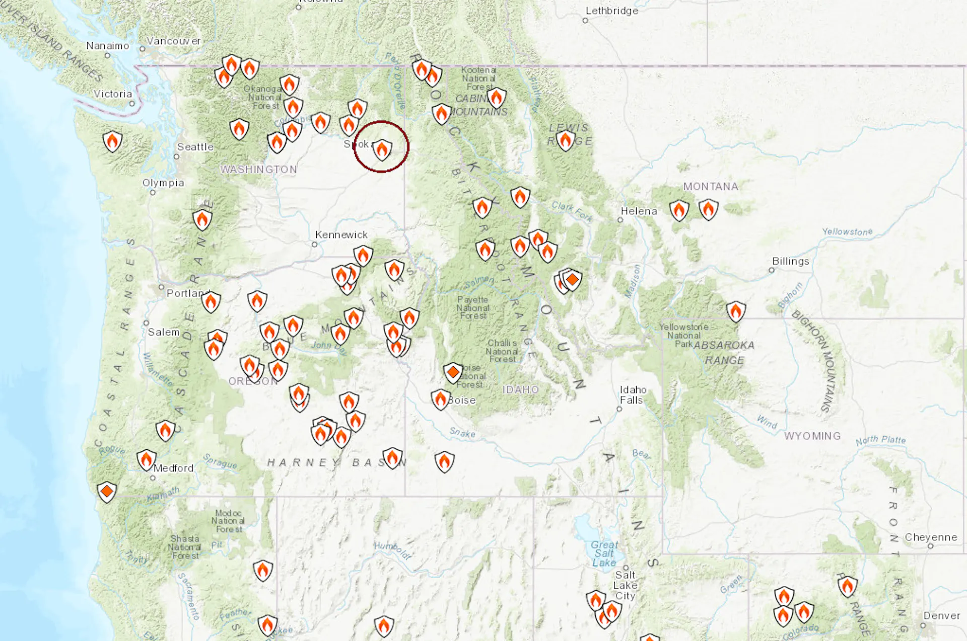 A map of the western U.S. shows several active fires. Spokane, in eastern Washington, is circled.