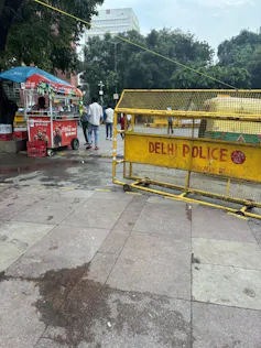 A derted square in New Delhi with police signs