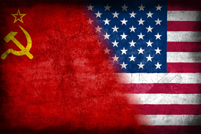 Soviet hammer and cycle flag and US flag blending together