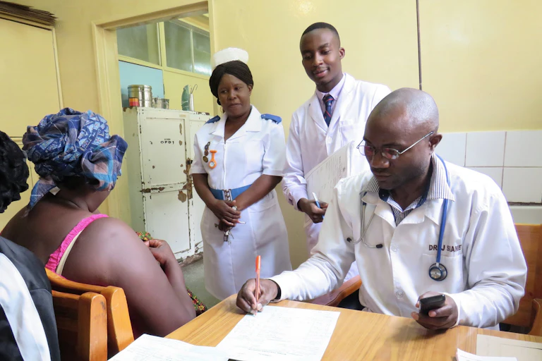 Medical staff consulting with a client