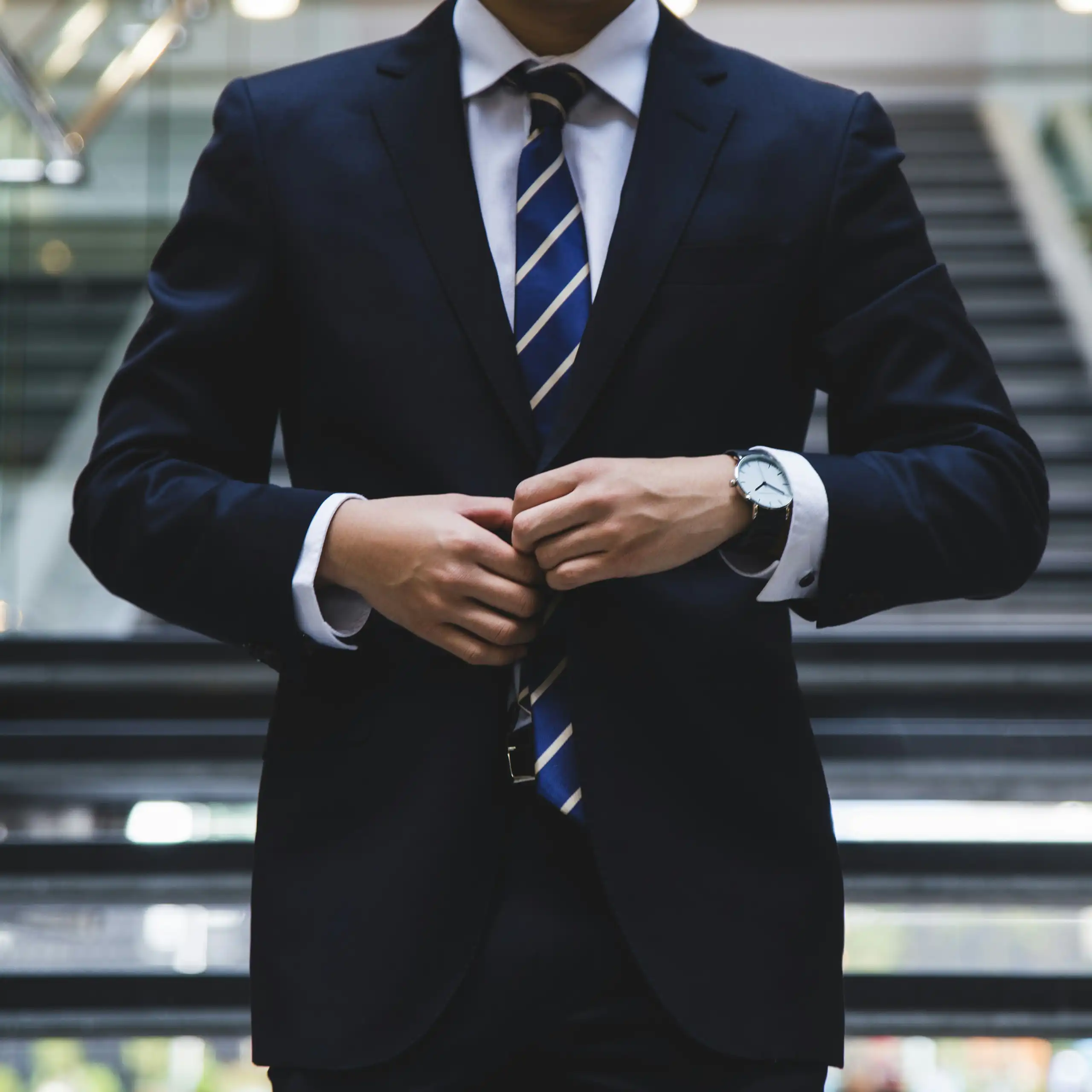 headless man in suit and tie