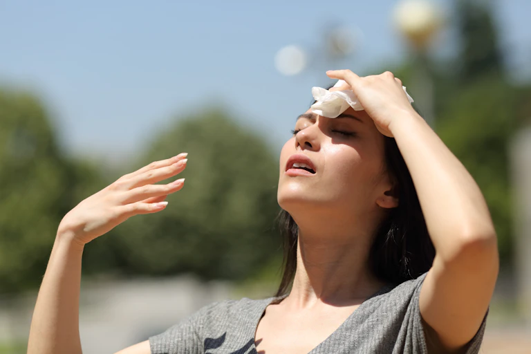 Woman suffering in the heat.