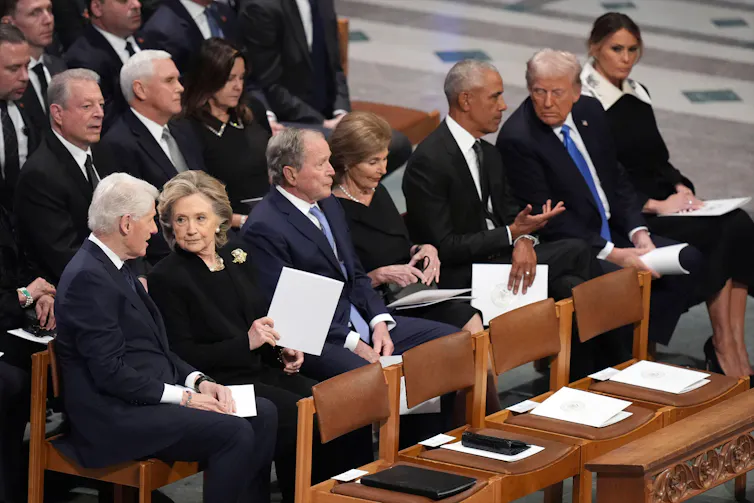 Donald Trump and former US presidents Barack Obama, George W. Bush and Bill Clinton with their wives at President Jimmy Carter's funeral in January 2025.