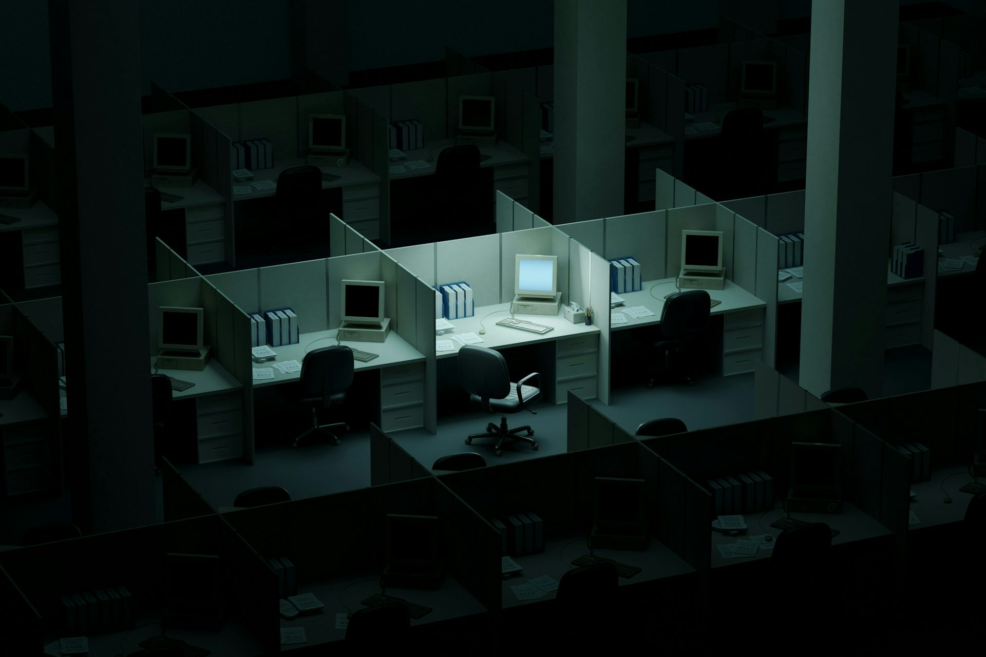 Une image de synthèse en 3D d'un espace de bureau composé de box. Chaque box contient un ordinateur, mais seul celui situé au centre, au milieu, a son écran allumé.