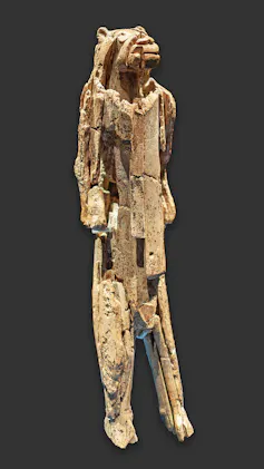 A crude model of a lioness's head on a human body