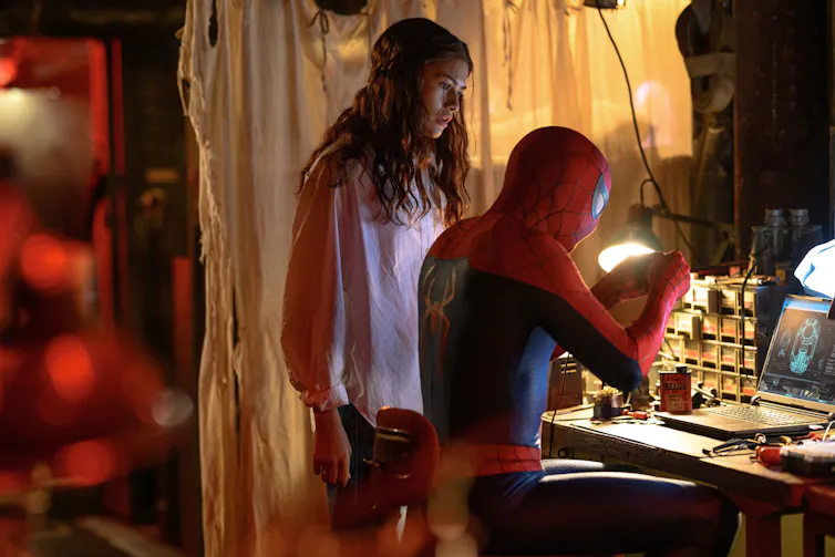 Movie still of Spider-Man and a young woman.