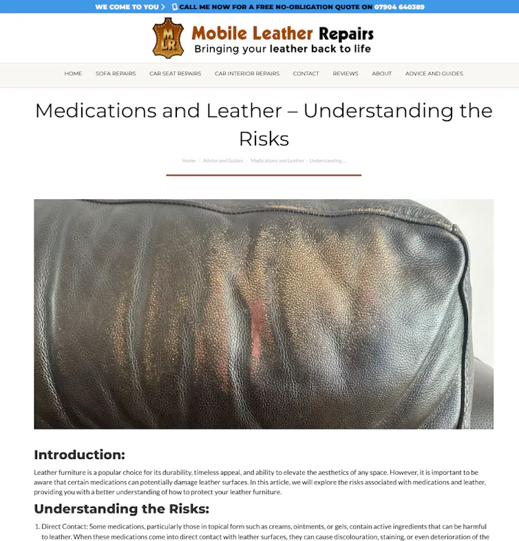 Damaged black leather sofa