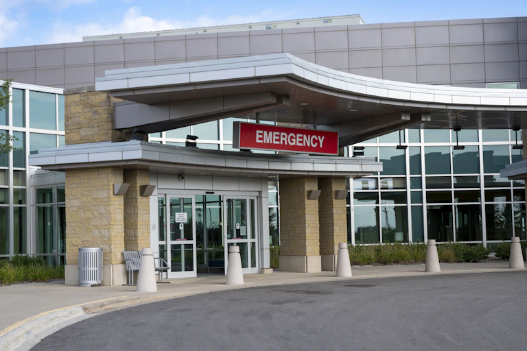 Hospital building with red emergency sign