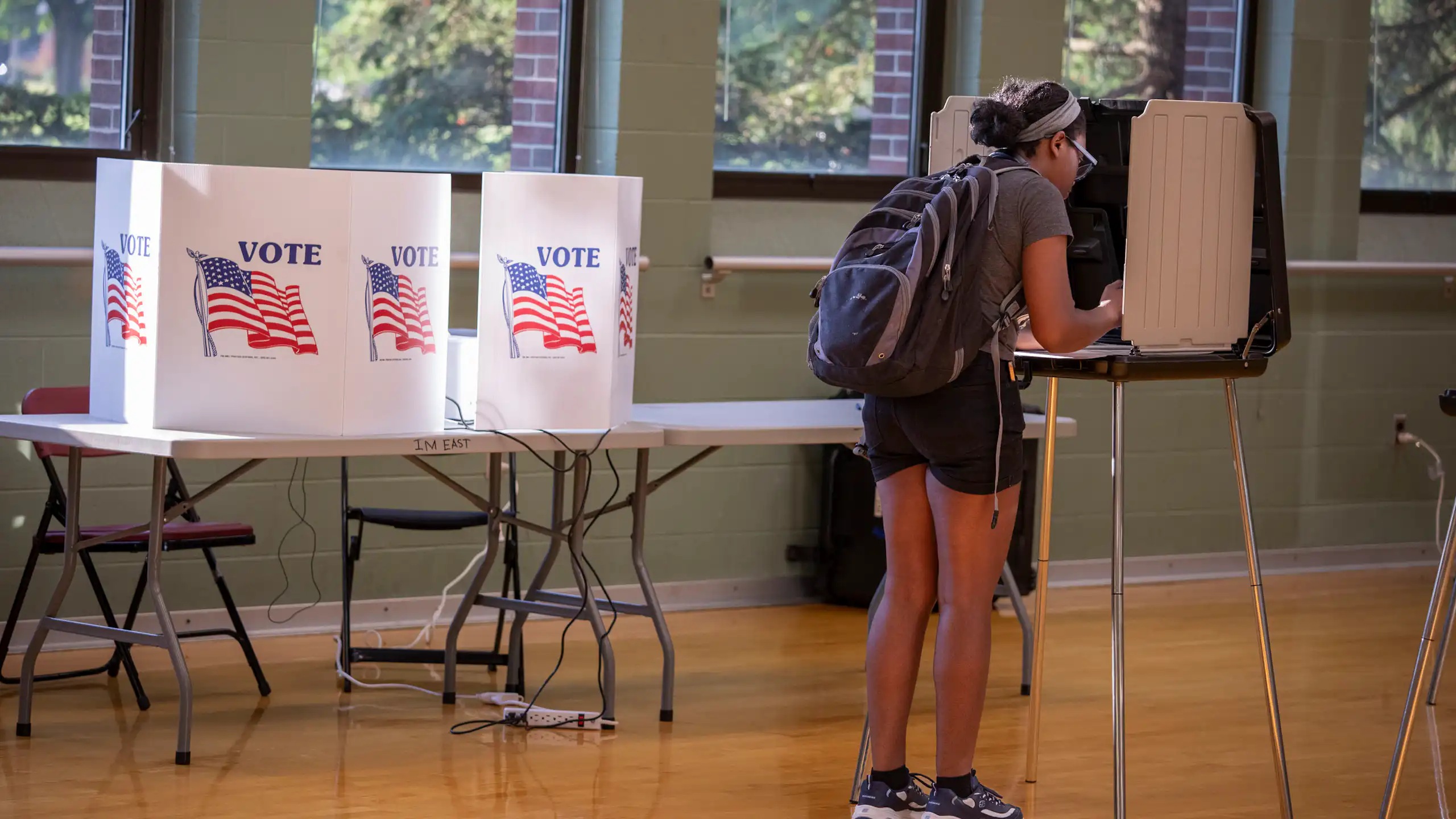 Female voter fills out ballot