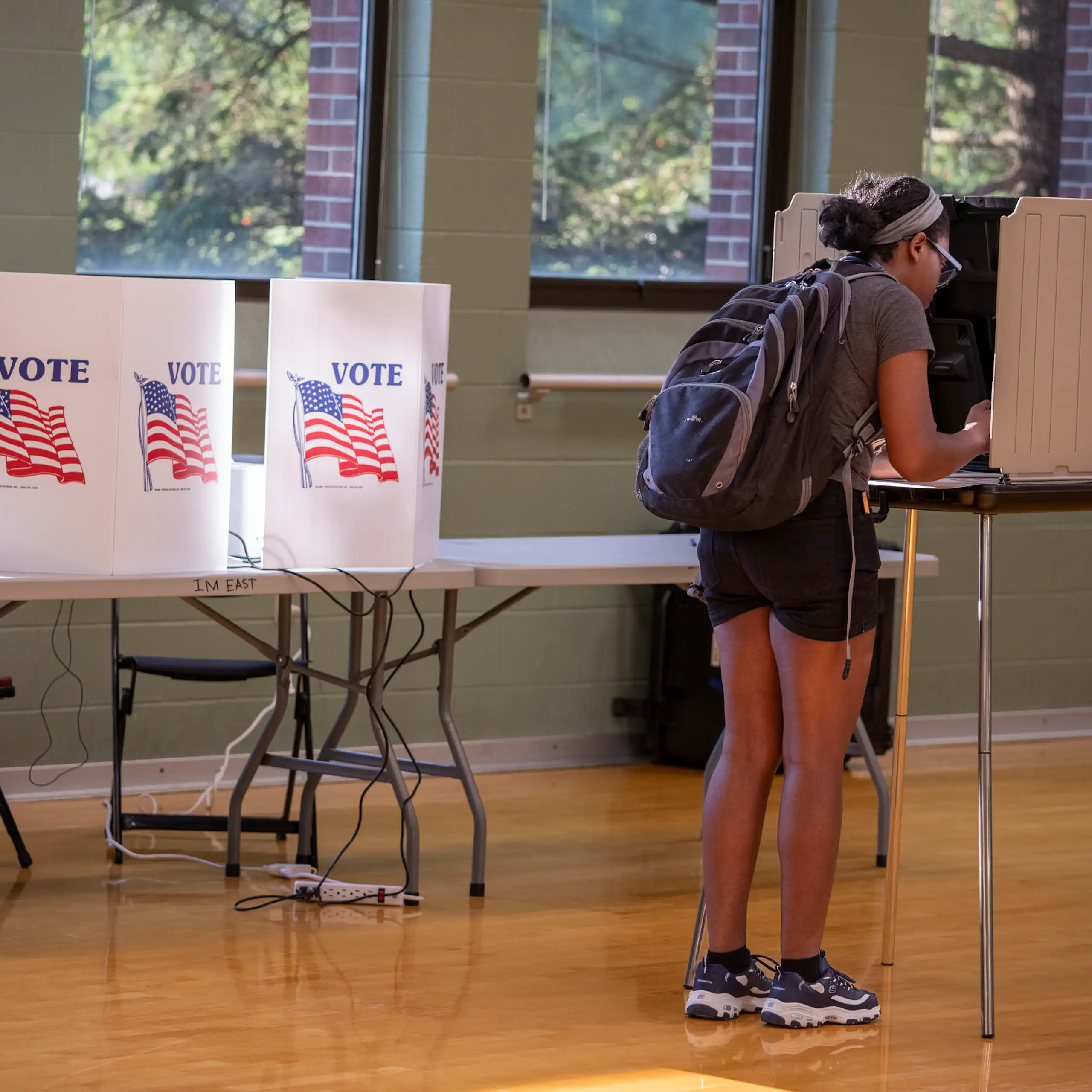 Female voter fills out ballot