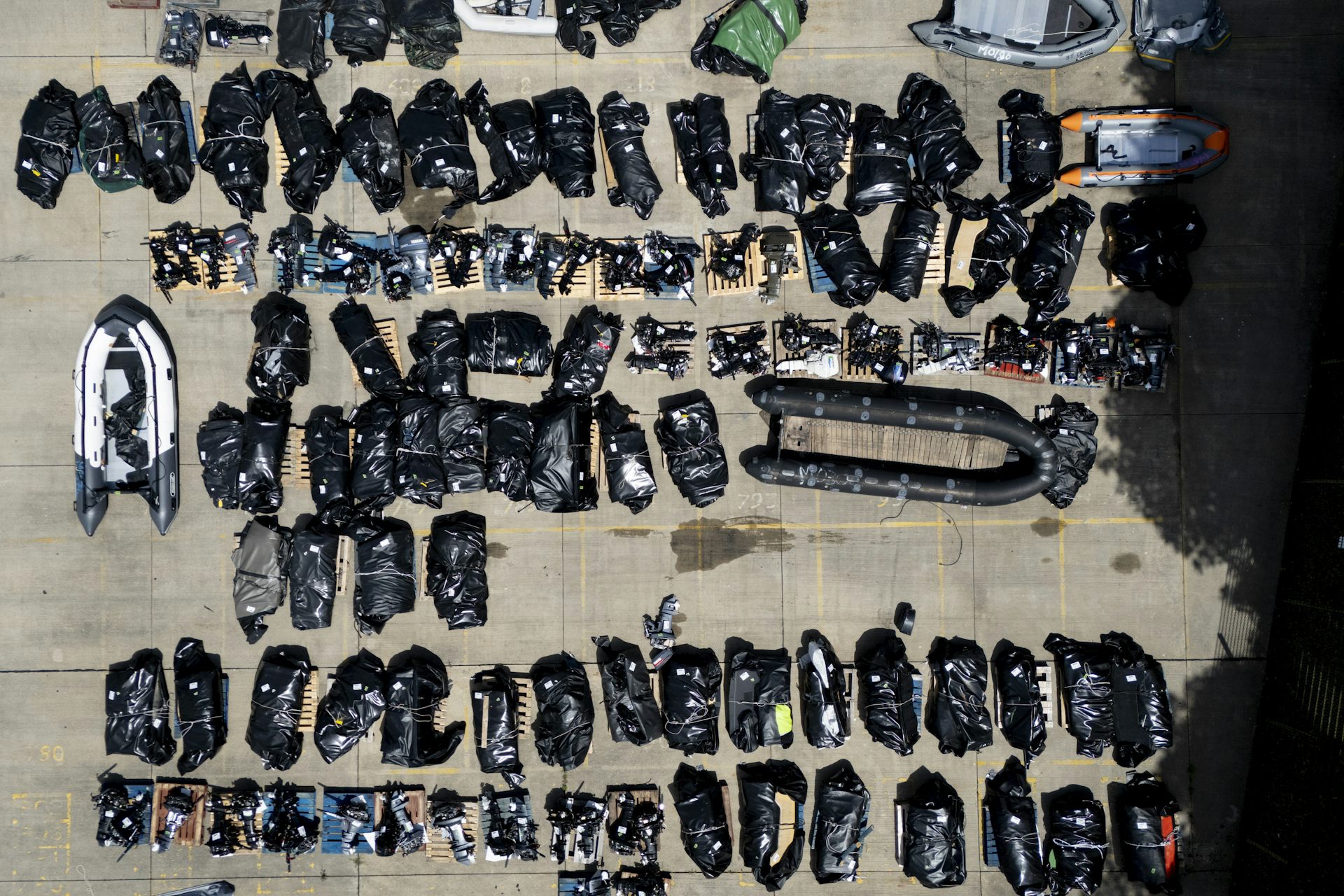 An assortment of small boats used by migrants to cross the Channel, stored at the UK Home Office facility in Dover, Kent.