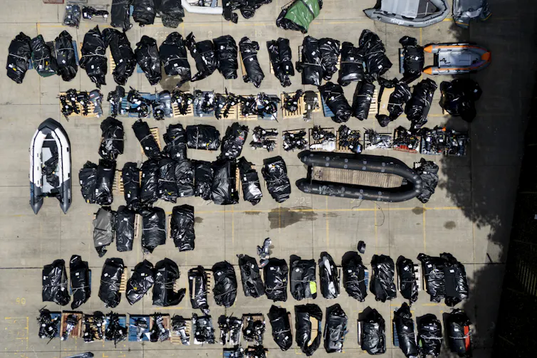 An assortment of small boats used by migrants to cross the Channel, stored at the UK Home Office facility in Dover, Kent.
