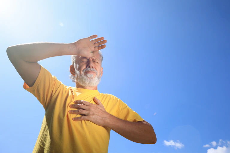 A man looking unwell in the sun.