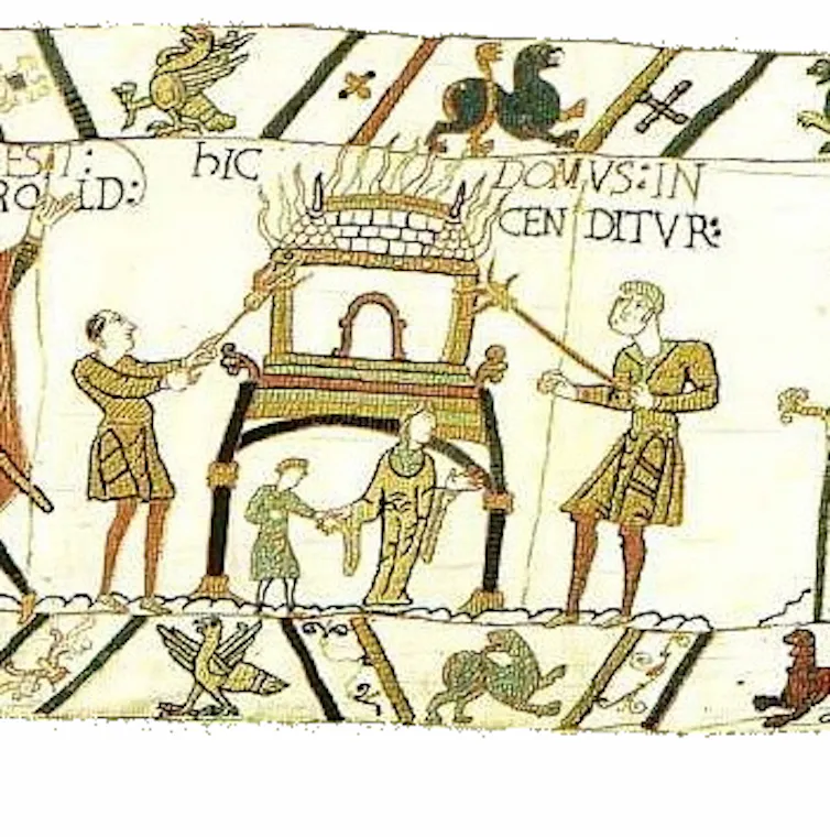 A section of the Bayeux tapestry showing a woman fleeing a burning house.