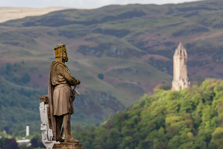 A statue to the medieval king Robert the Bruce near the Wallace monument at Stirling.
