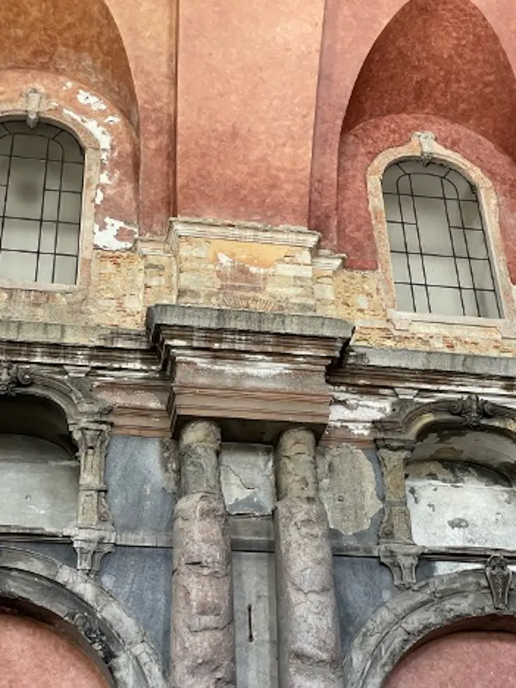 Different colors on burned walls of a church show different temperatures of the fire.