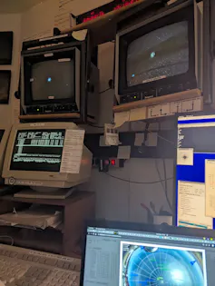 Computer screens in a control room.