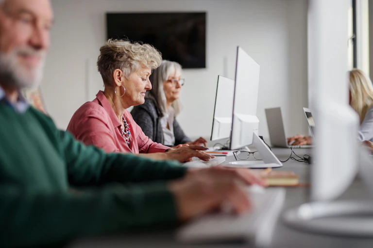 Older adults work on computers